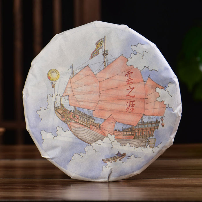 Tea cake with ship design and text on a wooden surface