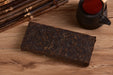 2009 Jinggu "Bamboo-Wrapped Long Brick" Ripe Pu-erh Tea | Yunnan Sourcing Tea Shop