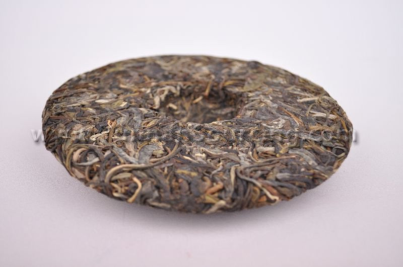 2010 Yunnan Sourcing "Ding Jia Zhai" Autumn Harvest Yi Wu Pu-erh Tea Cake