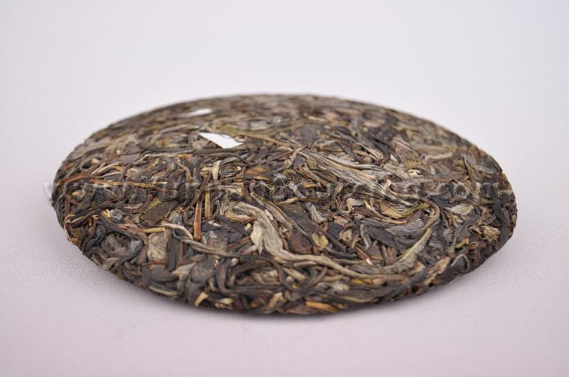 2010 Yunnan Sourcing "Ding Jia Zhai" Autumn Harvest Yi Wu Pu-erh Tea Cake